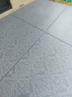 Stencilled floor with a large damask stencil